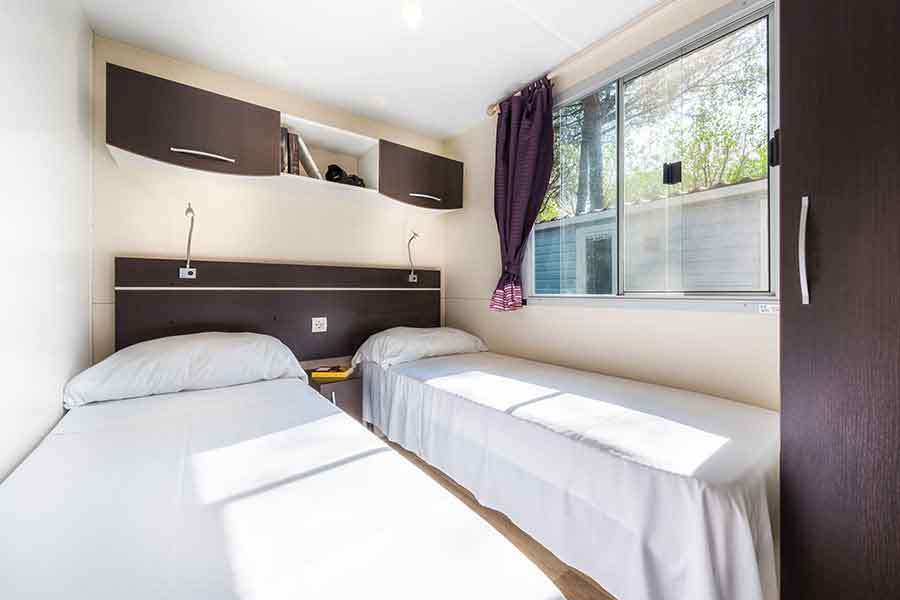 Double bedroom of the maxi caravan with two single beds