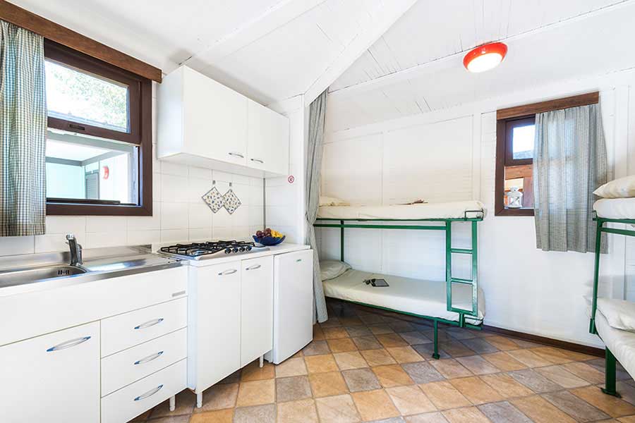 Mini-bungalow interior with kitchen and two bunk beds