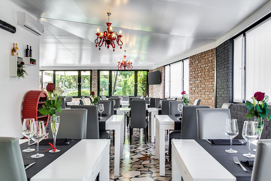 Restaurant with modern decor with tables set