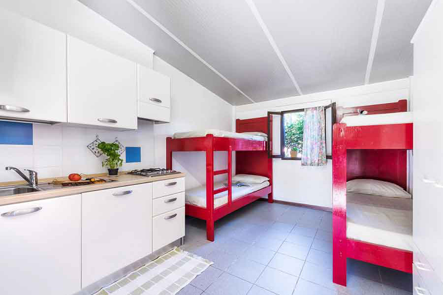 Interior of the mini-bungalow with kitchen and two bunk beds